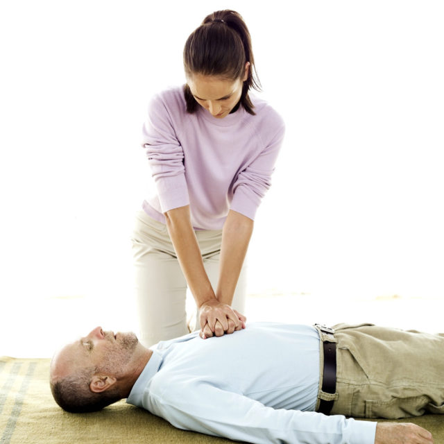 Young Woman Performing Cardiopulmonary Resuscitation --- Image by © Royalty-Free/Corbis